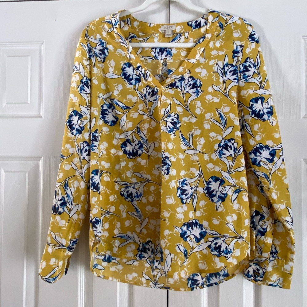 Long sleeve yellow blouse.